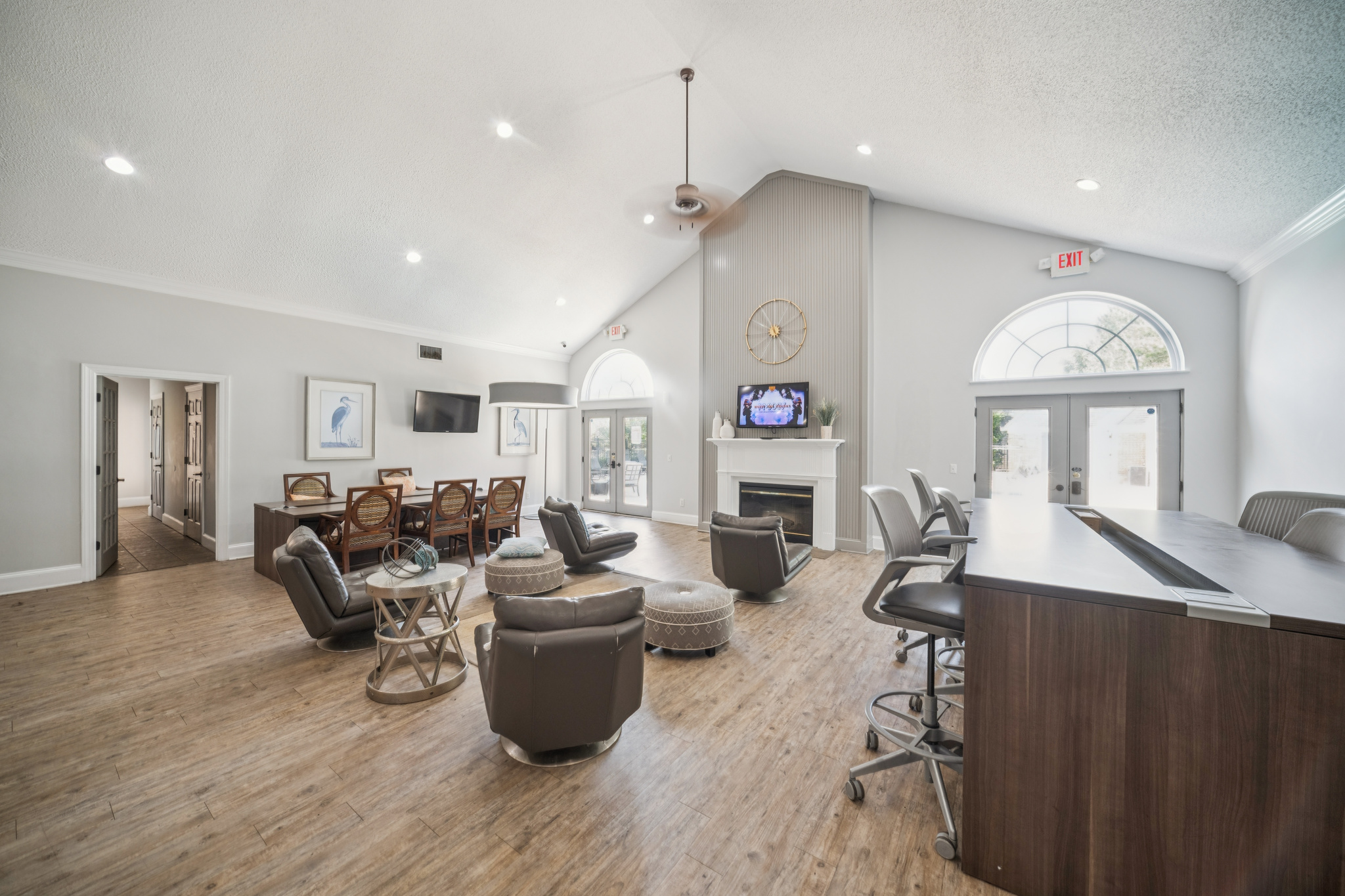 a room with a fireplace and chairs