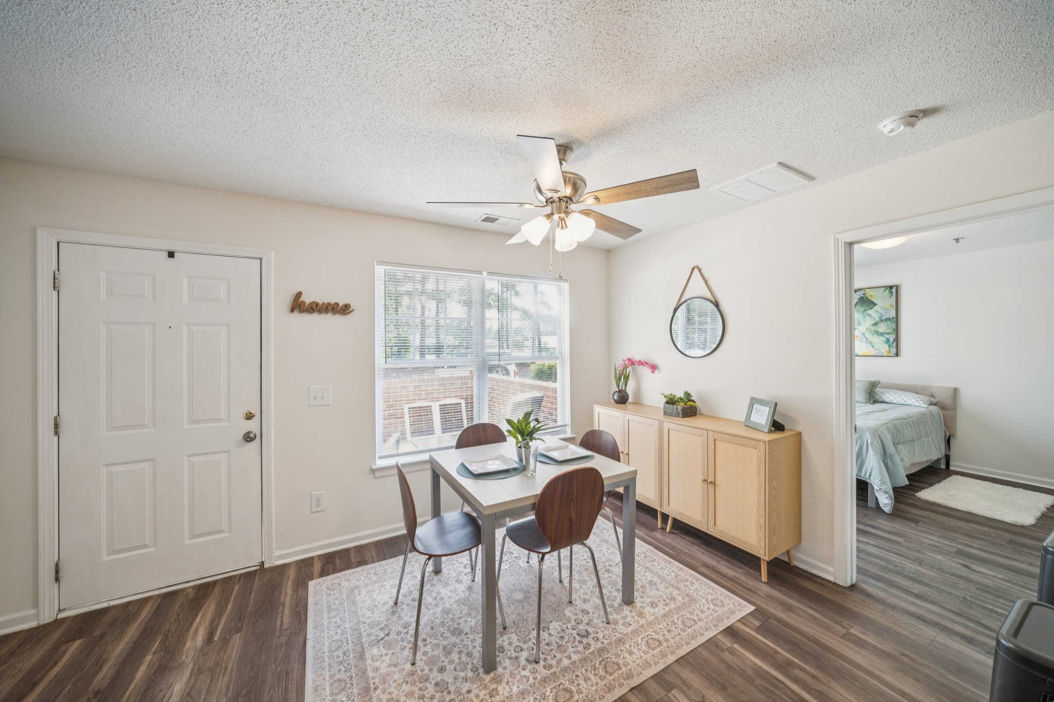 a dining table and chairs in a room