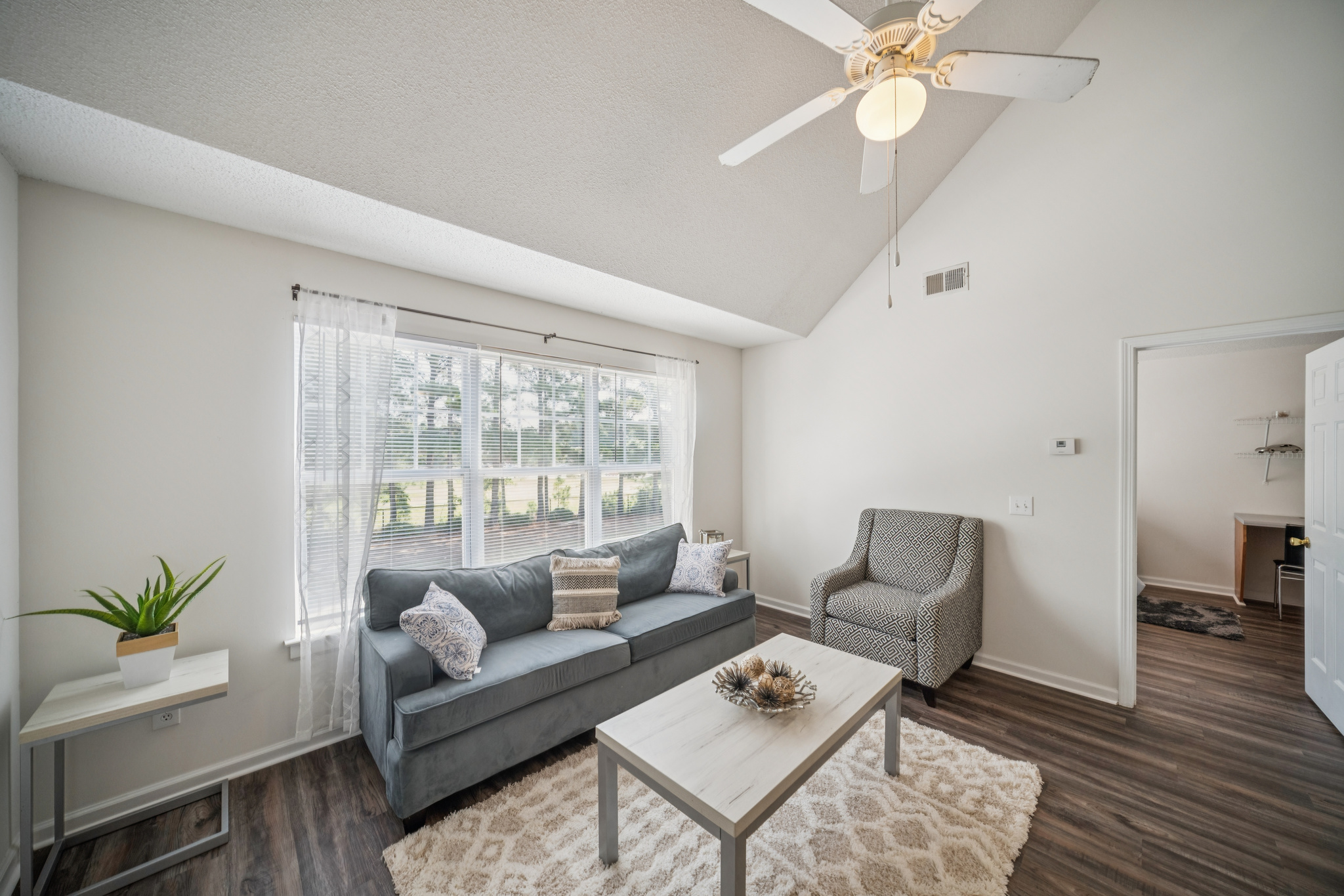 a living room with a couch and a table