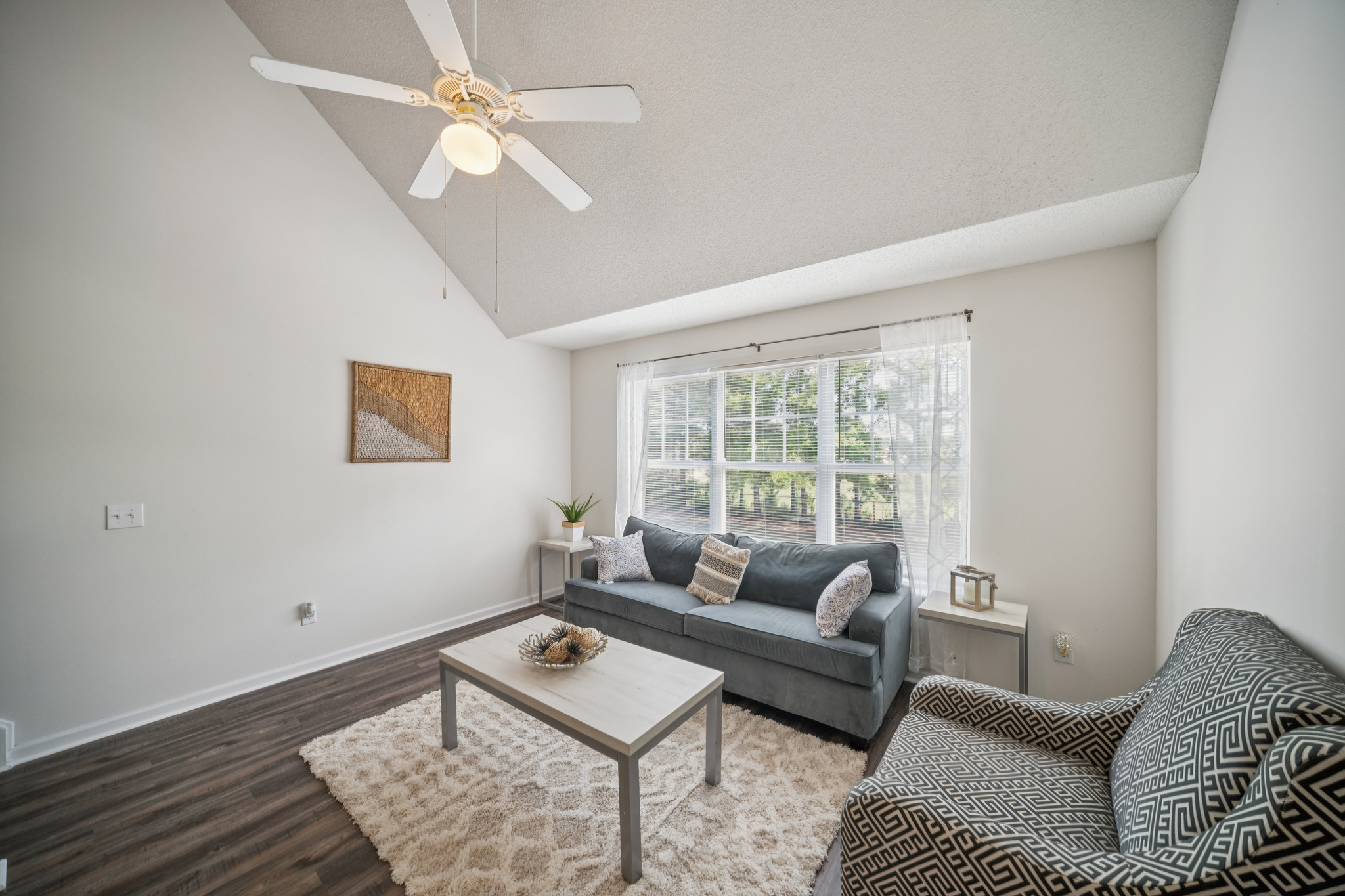 a living room with a couch and a table