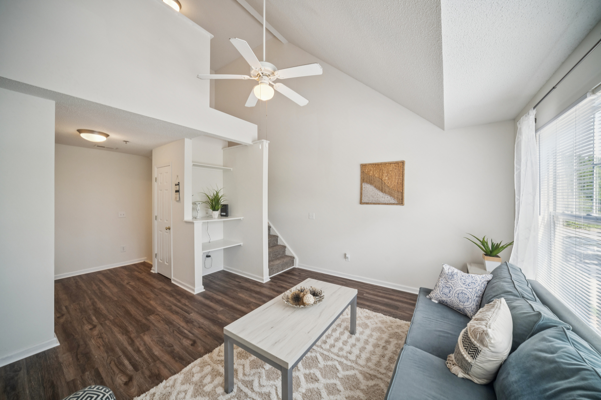 a living room with a couch and a table