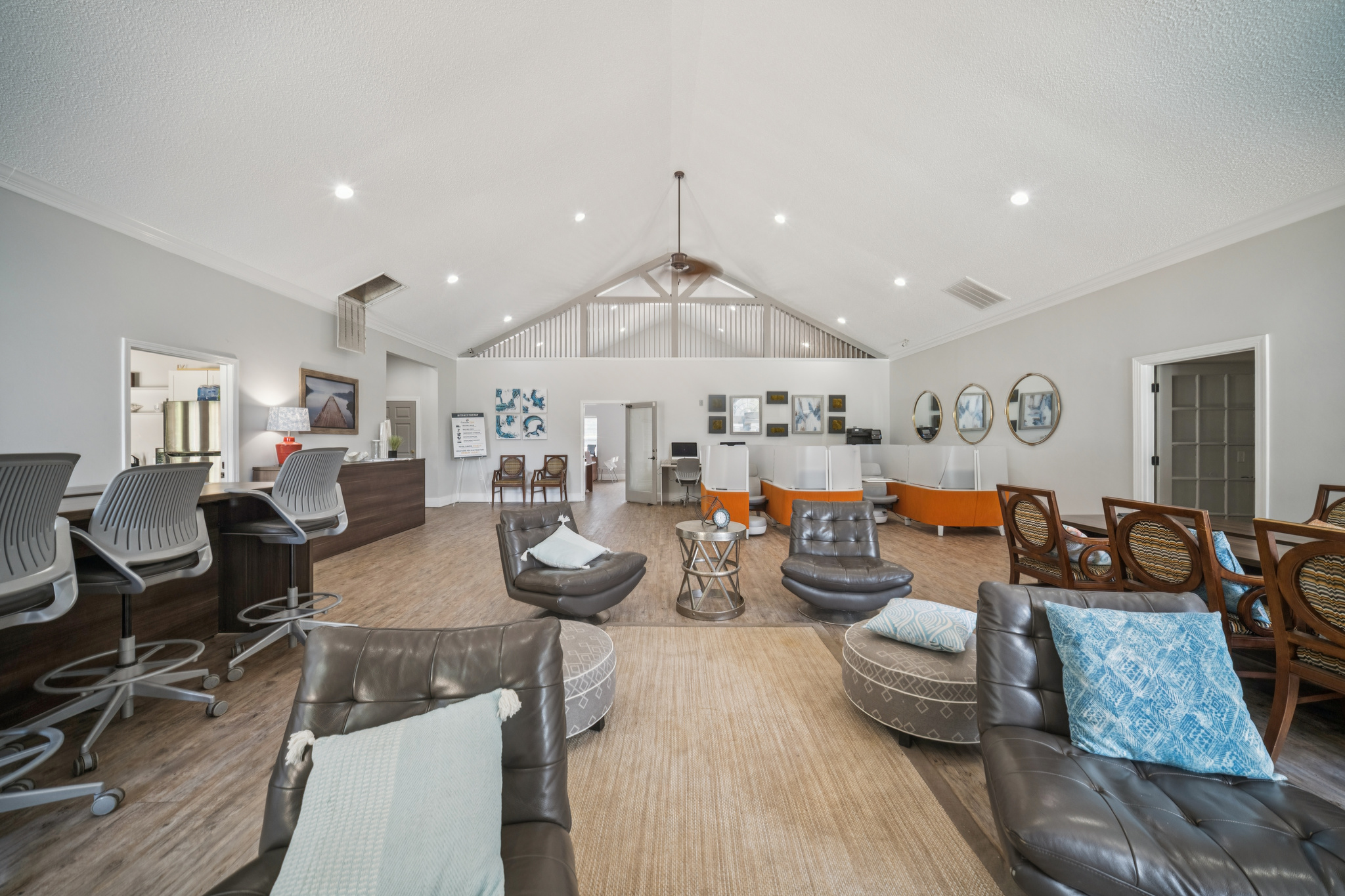 a room with a large reception desk and chairs