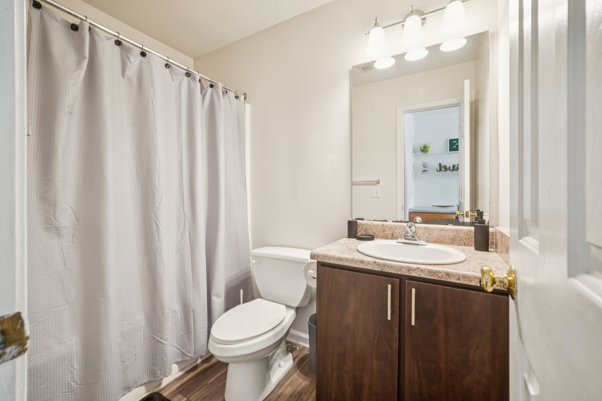 a bathroom with a sink and toilet
